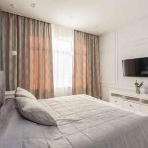 Stylish bedroom featuring elegant design elements and modern furnishings.
